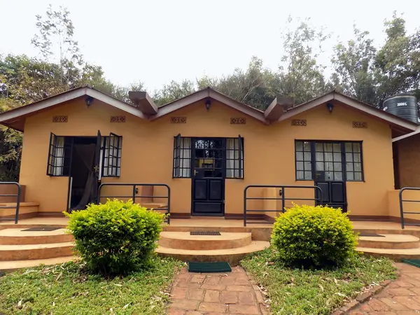 Ochre annex rooms with steps up to each door